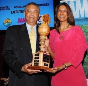 Caribbean publisher Neysha Soodeen (right) is congratulated by Donnie Dawson of the Jamaica Tourist Board